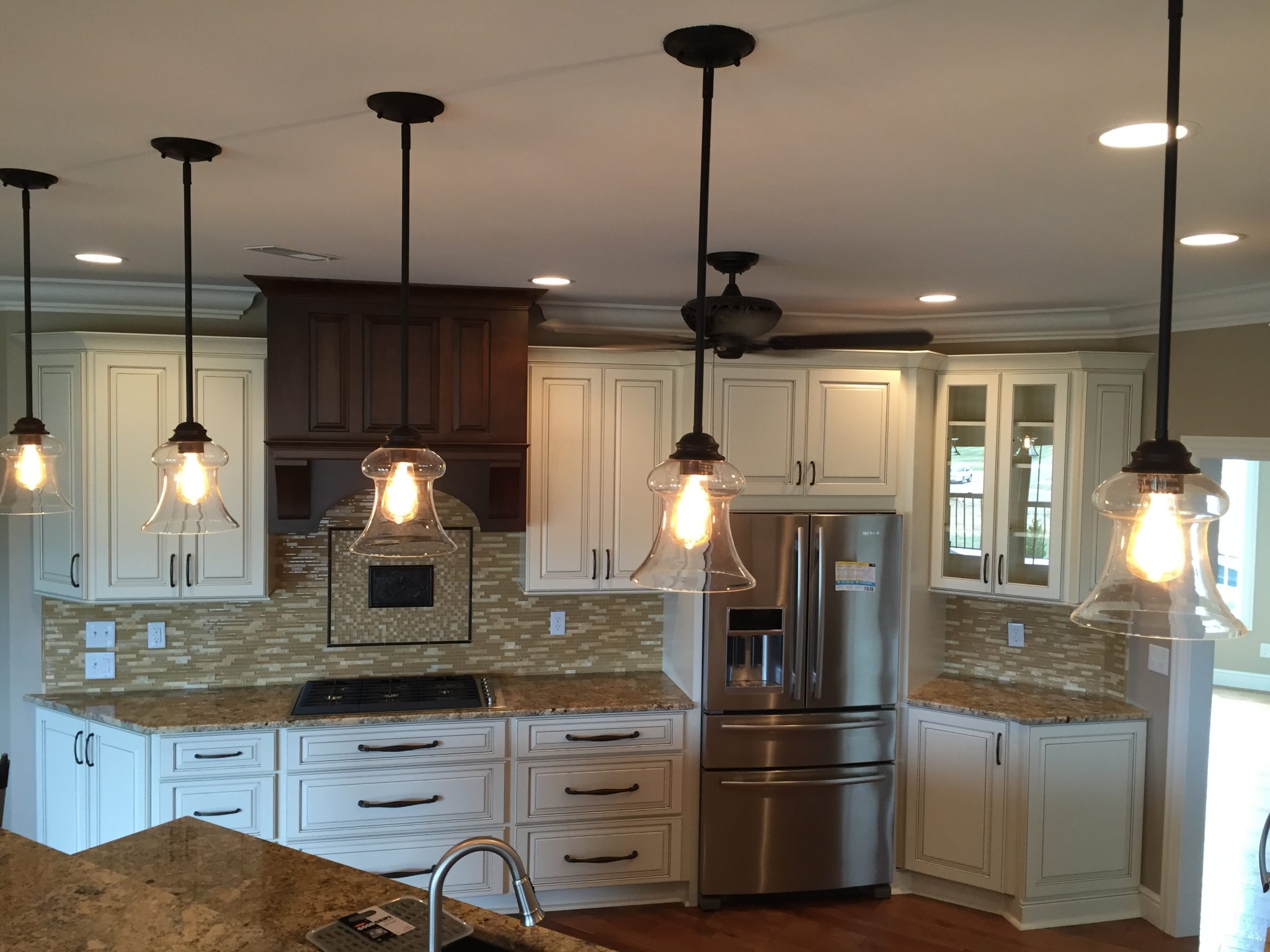 close up of hanging lights in kitchen
